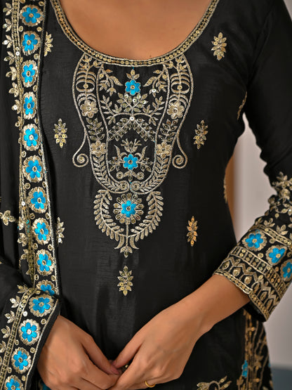 Close up of black kurta sharara set showing detailed embroidery and 5mm sequence work on neckline