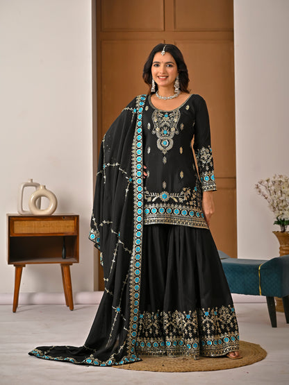 Black sharara suit with embroidered dupatta styled for festive and party wear