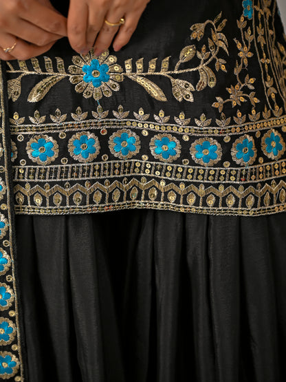 Close up fabric detail of black vichitra silk kurta sharara set with premium texture
