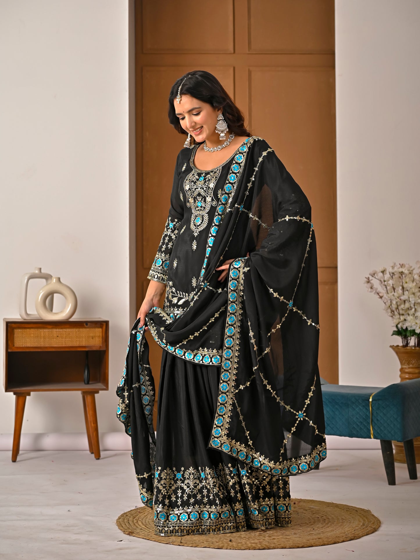 Black wedding wear kurta sharara set with heavy embroidery and elegant dupatta