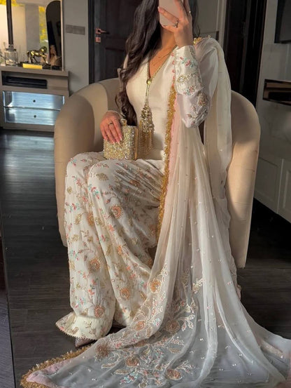 Cream ethnic suit side view with dupatta elegant traditional outfit