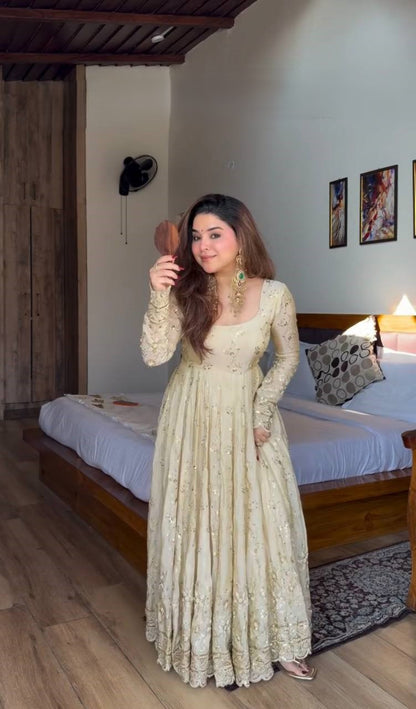 Ethnic cream gown with intricate sequin embroidery
Party wear cream Anarkali dress with elegant look
Designer Anarkali gown in cream color with detailing