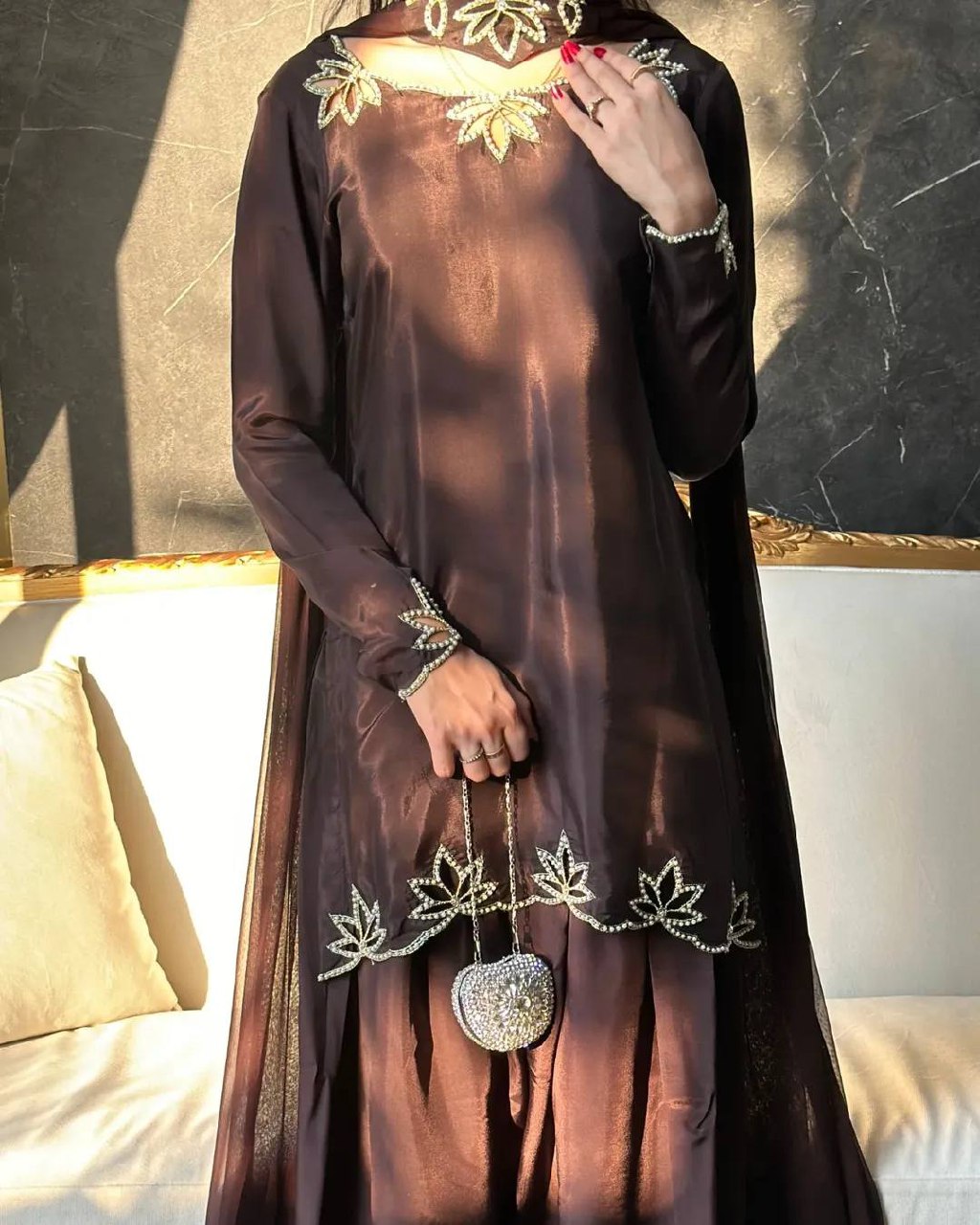 Close-up of heavy natural crepe top showing embroidery and moti work details