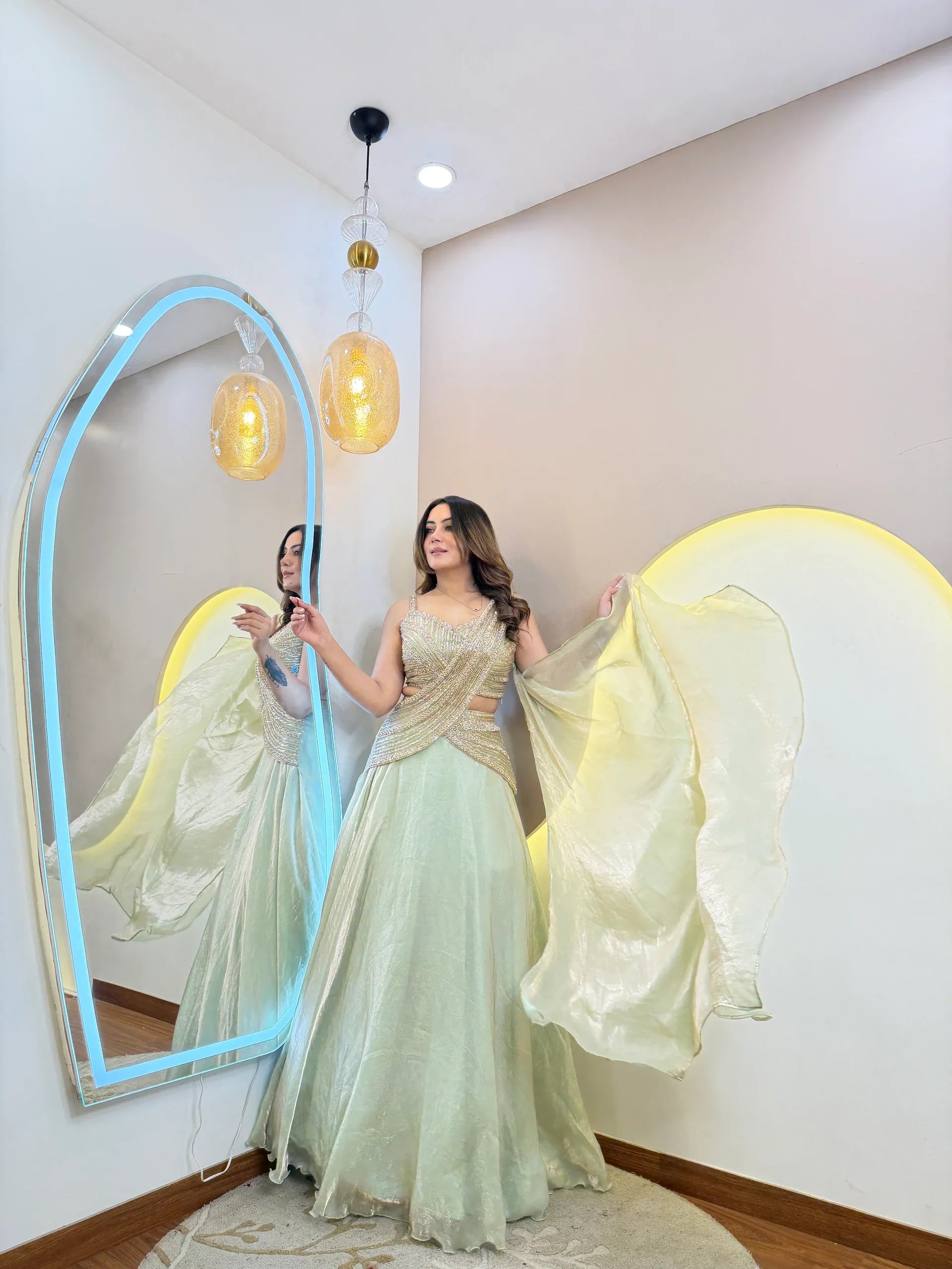 Mint green designer lehenga set with gold embellished blouse front view party wear outfit