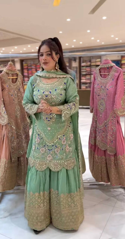 Mint green embroidered sharara suit with heavy sequence work and elegant front view for festive wear