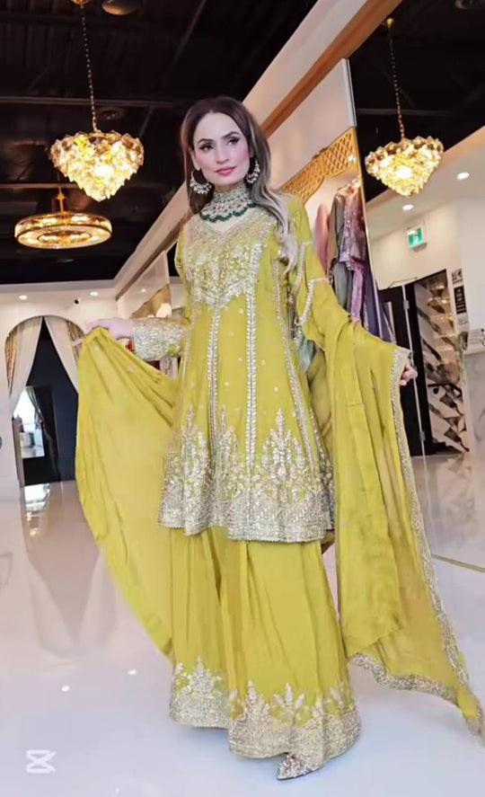 Mustard yellow Anarkali suit with matching dupatta and intricate embroidery, wedding and festive wear