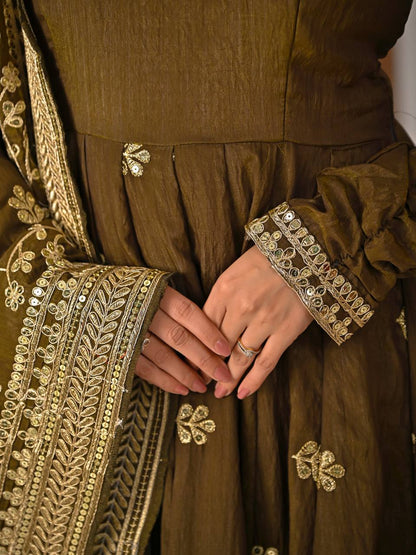 Close-up embroidery work on olive green Anarkali suit with intricate floral motifs