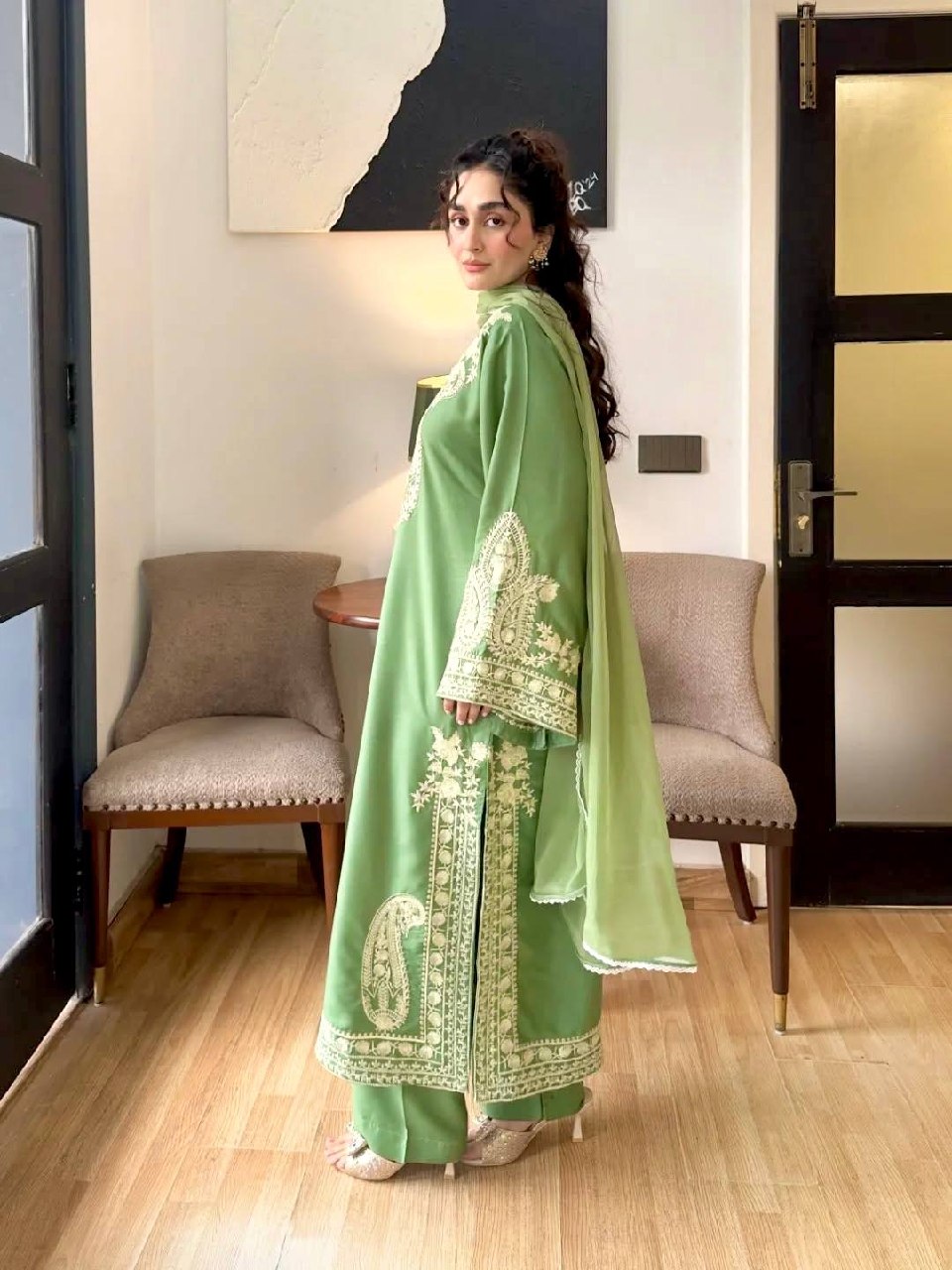 Detailed embroidery work on parrot green organza silk kurta