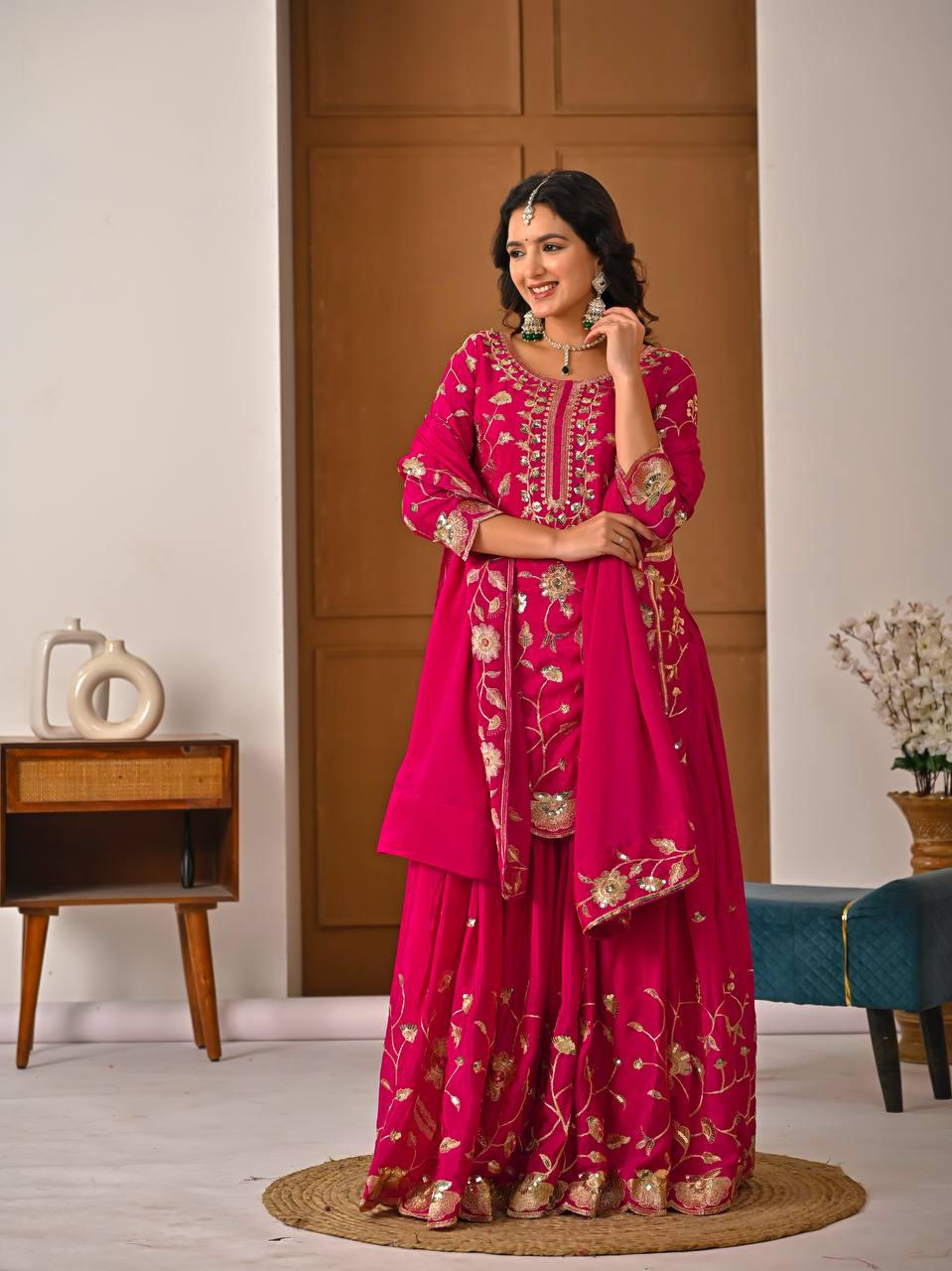 Pink chinnon silk lehenga set showing heavy embroidery work and matching dupatta detail
