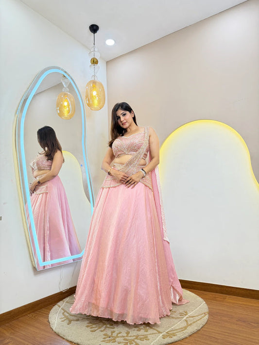 Pink fandy organza lehenga choli with cancan, handwork belt and draped dupatta front view