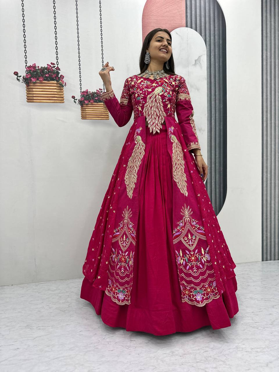 Close-up of heavy thread and sequence embroidery on pink Vichitra choli
