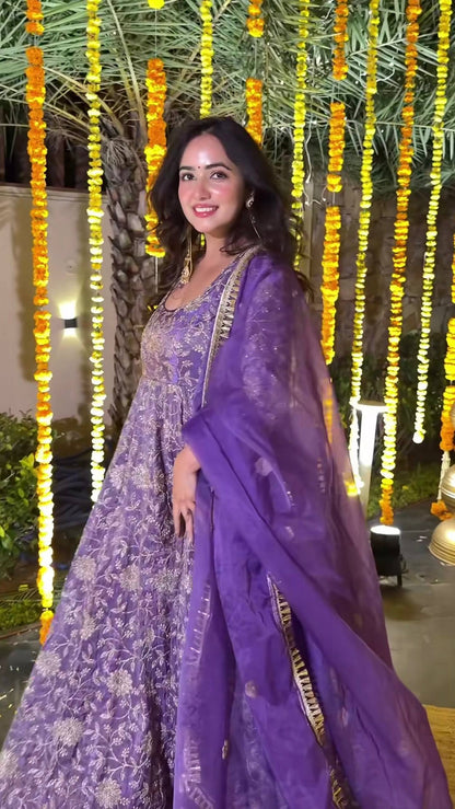 Back view of purple embroidered Anarkali suit with full sleeves and elegant design