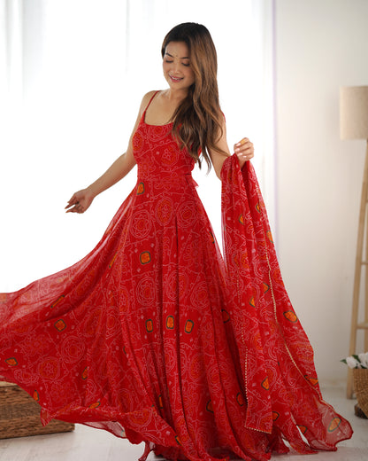 Woman wearing a red patterned dress in a bright room