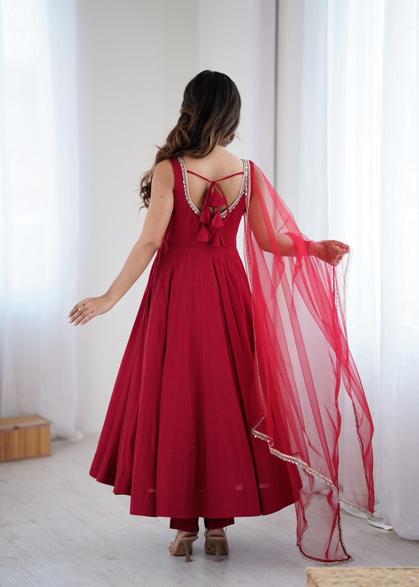 Back view of red Anarkali suit with side zipper