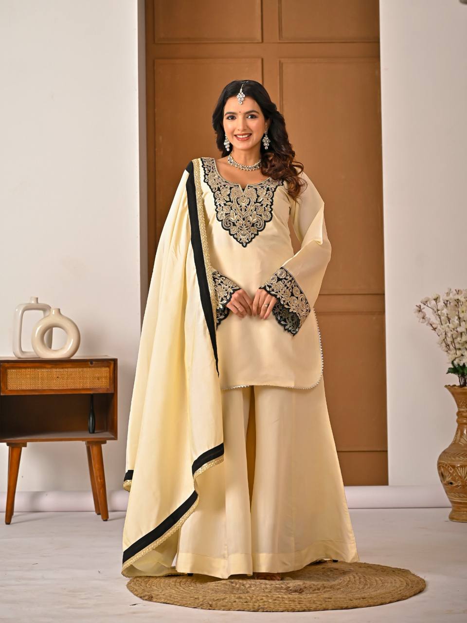 Roman silk embroidered sharara suit front view with dupatta