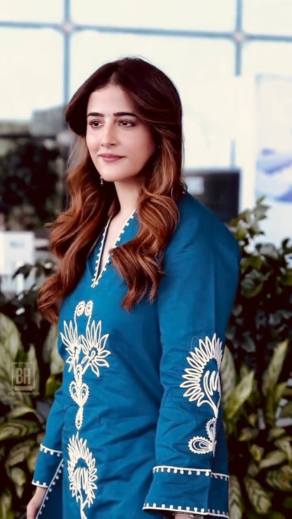 Close up embroidery detail of teal rayon kurta set with thread work design