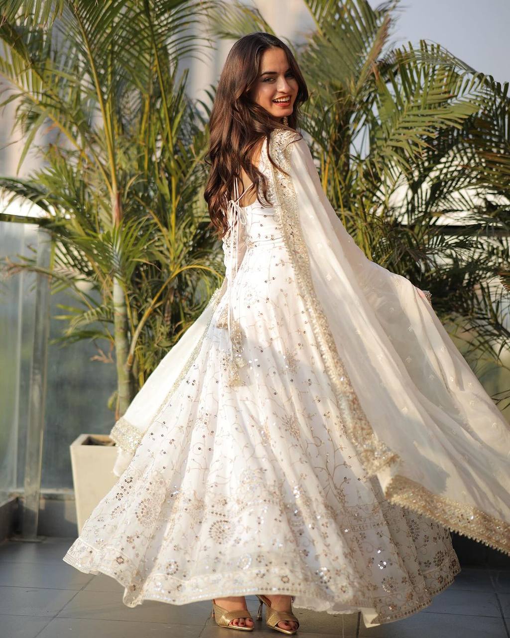 Heavy faux georgette white Anarkali gown with 12 kali full flair and sequence embroidery