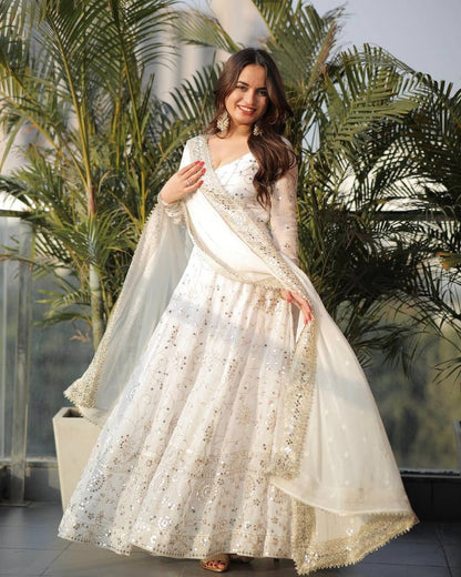 Elegant white Anarkali gown with matching faux georgette dupatta and embroidery work