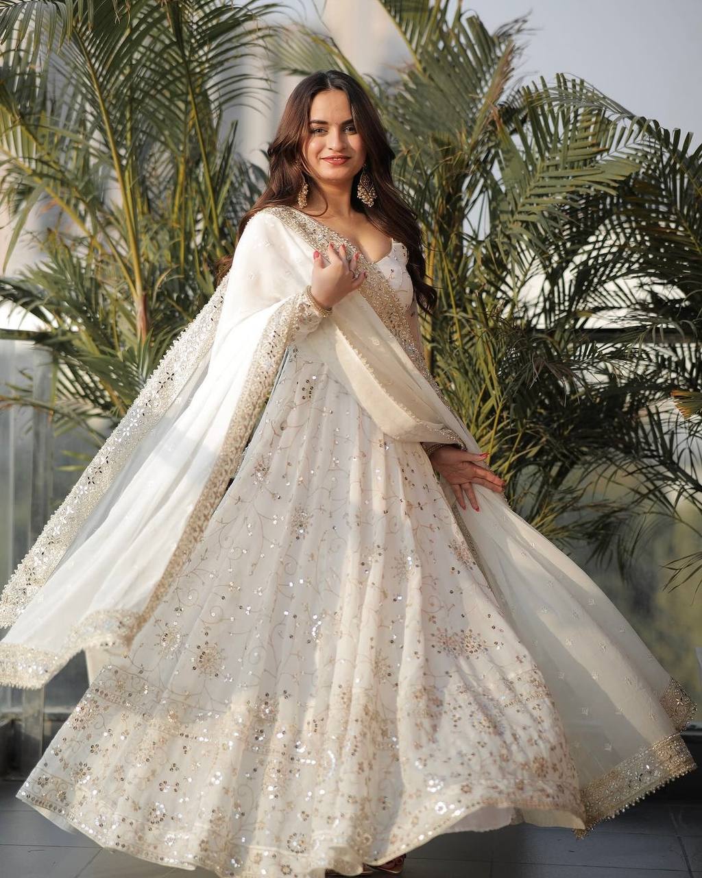 White embroidered Anarkali gown in heavy faux georgette with full sleeves and lace border front view