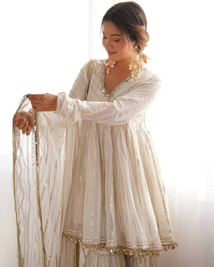 White sharara suit dupatta with golden border detailing, elegant ethnic fashion for women