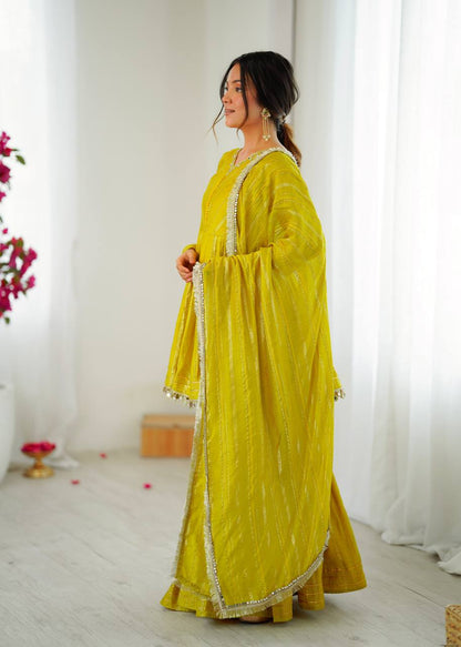 Yellow sharara suit dupatta with golden border detailing, graceful ethnic fashion for women